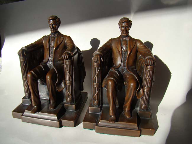 A fine pair of "LINCOLN in the chair" bookends by Jennings Brothers circa 1925